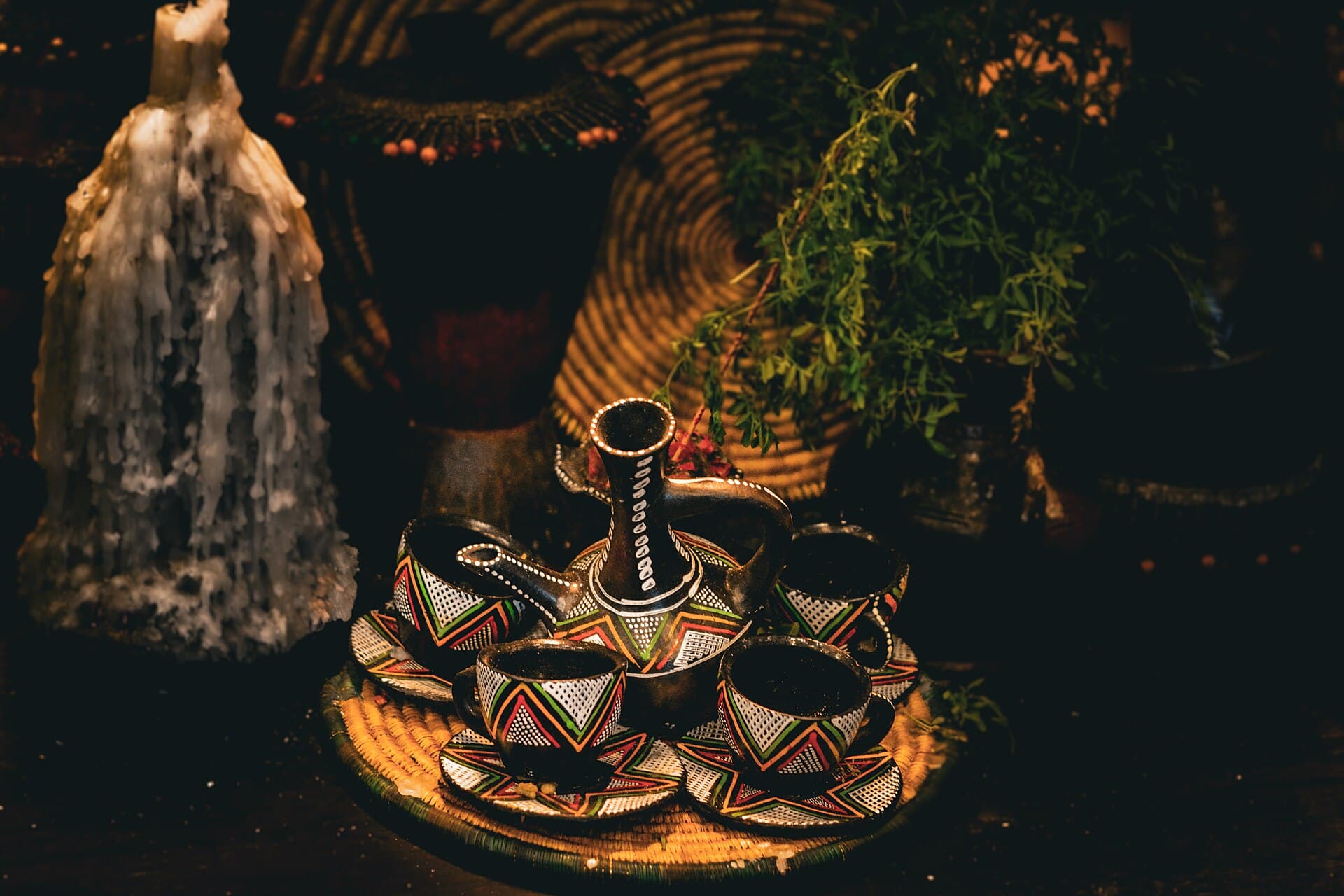 Traditional Ethiopian coffee ceremony with jebena and roasting pan